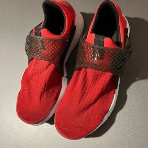 Red and black Nike shoes